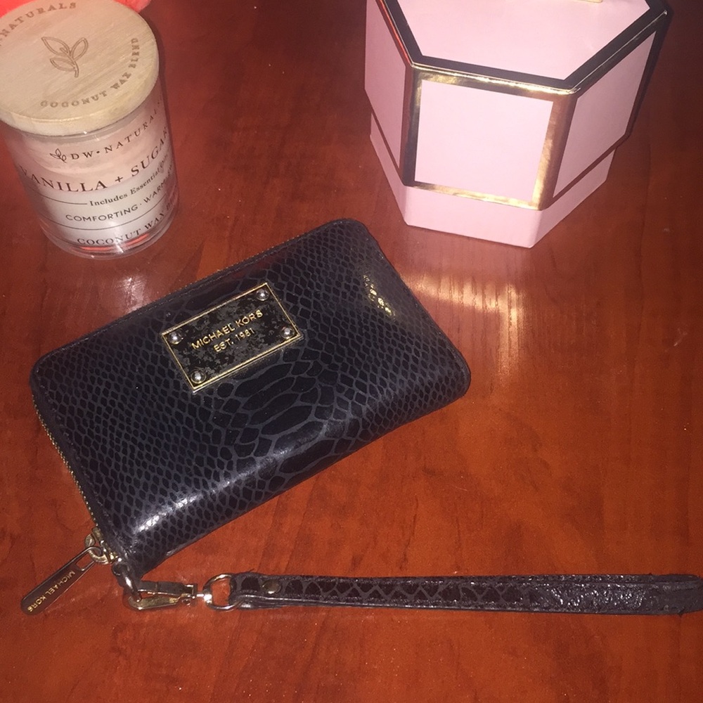 Michael Kors wristlet Black used some wear & tear